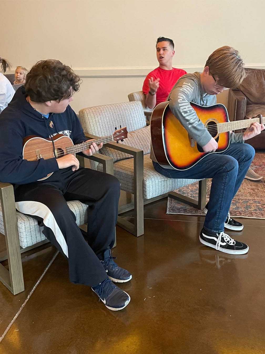 Josh and Chad learning new chords in music class